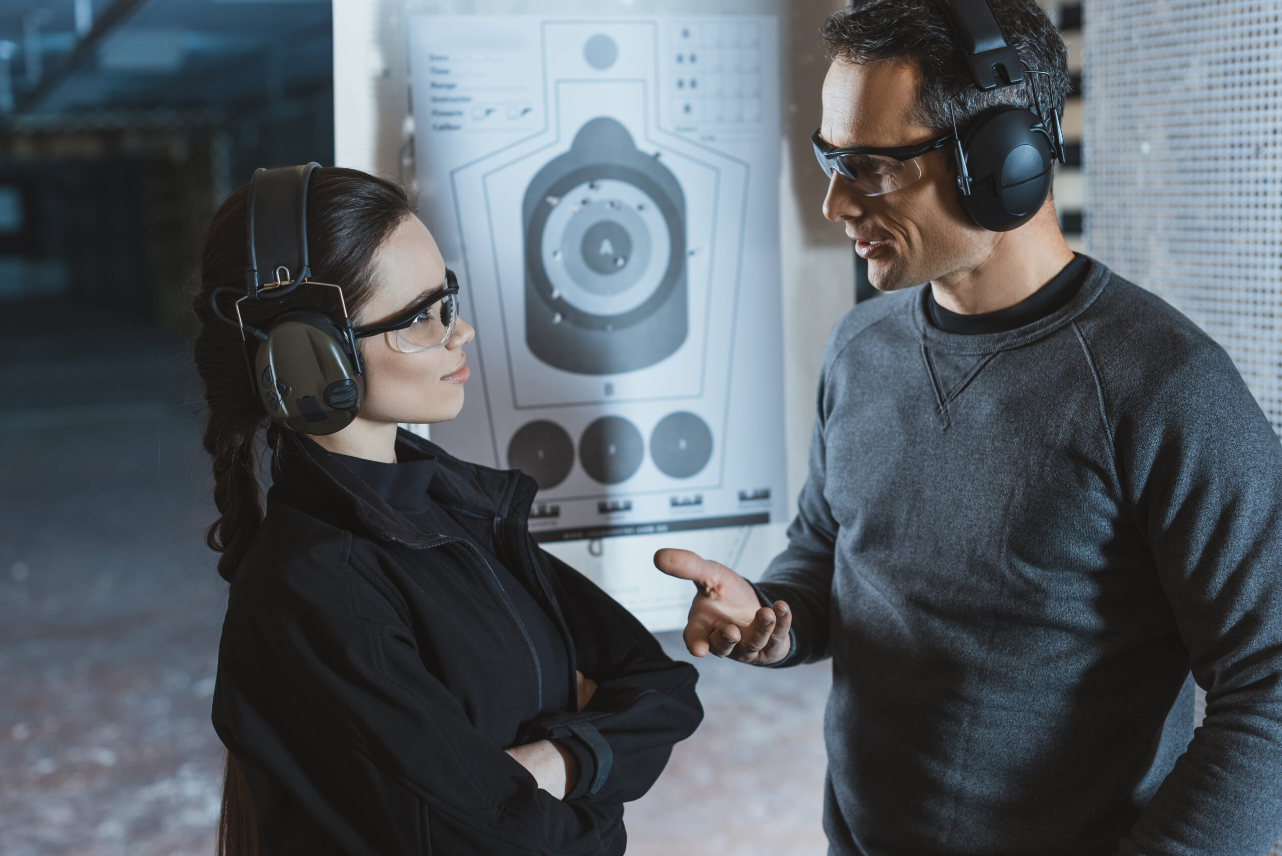 Shooting,Instructor,And,Client,Talking,In,Shooting,Range